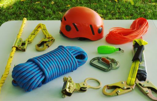 Safety equipment used to climb a including, a helmet, rope, fall-arrest gear