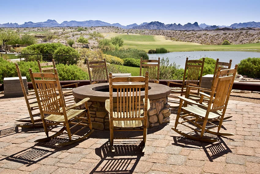 Outdoor patio rocking chairs around fire pit