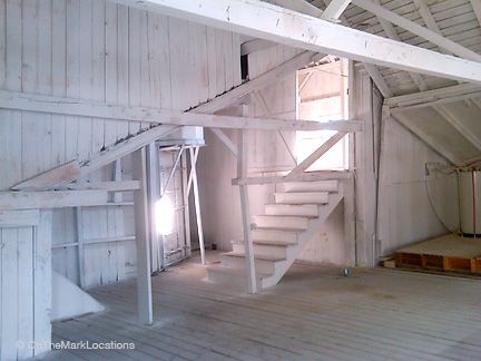 whitewashing inside a barn