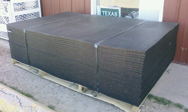 Pallet of horse stall mats at a feedstore