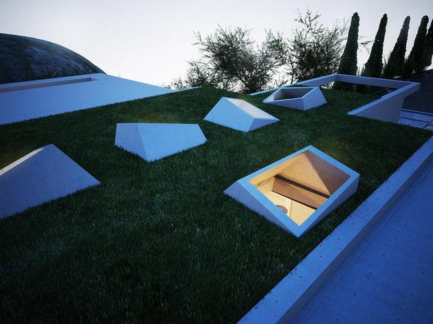 creatively-semi-buried-home-rises-earth-art-8-skylights.jpg